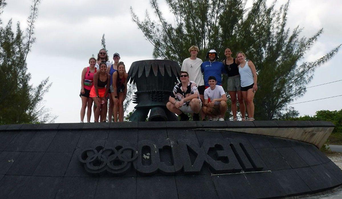 Students at the site where the Olympic flame landed on its way to Mexico City in 1968