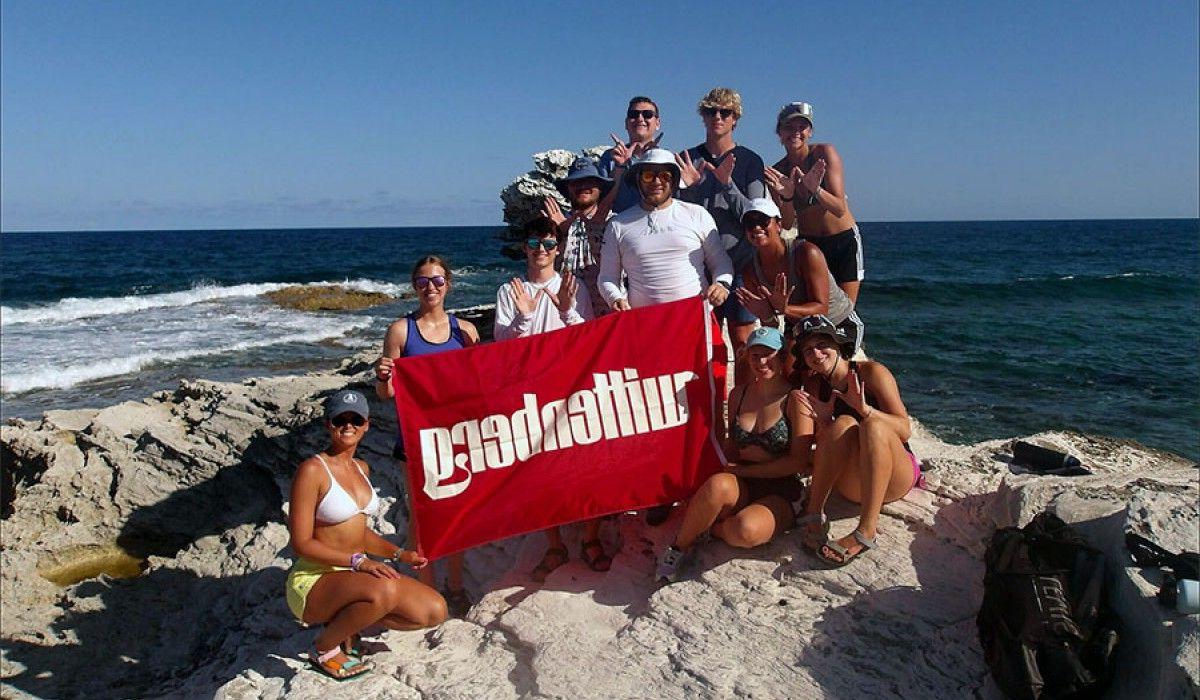 Wittenberg Students Holding Banner On Beach