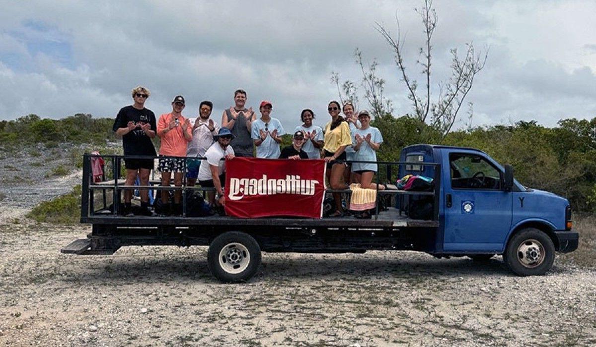 students on a truck holding a wittenberg flag