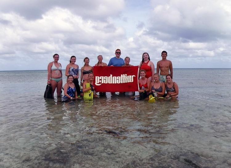 Snorkelers heading out to the reef