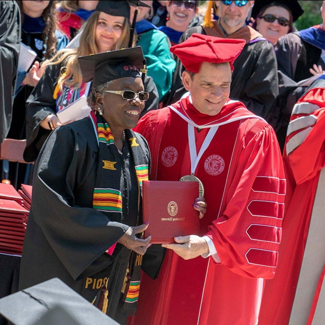 President Frandsen with Adult Student at Commencement